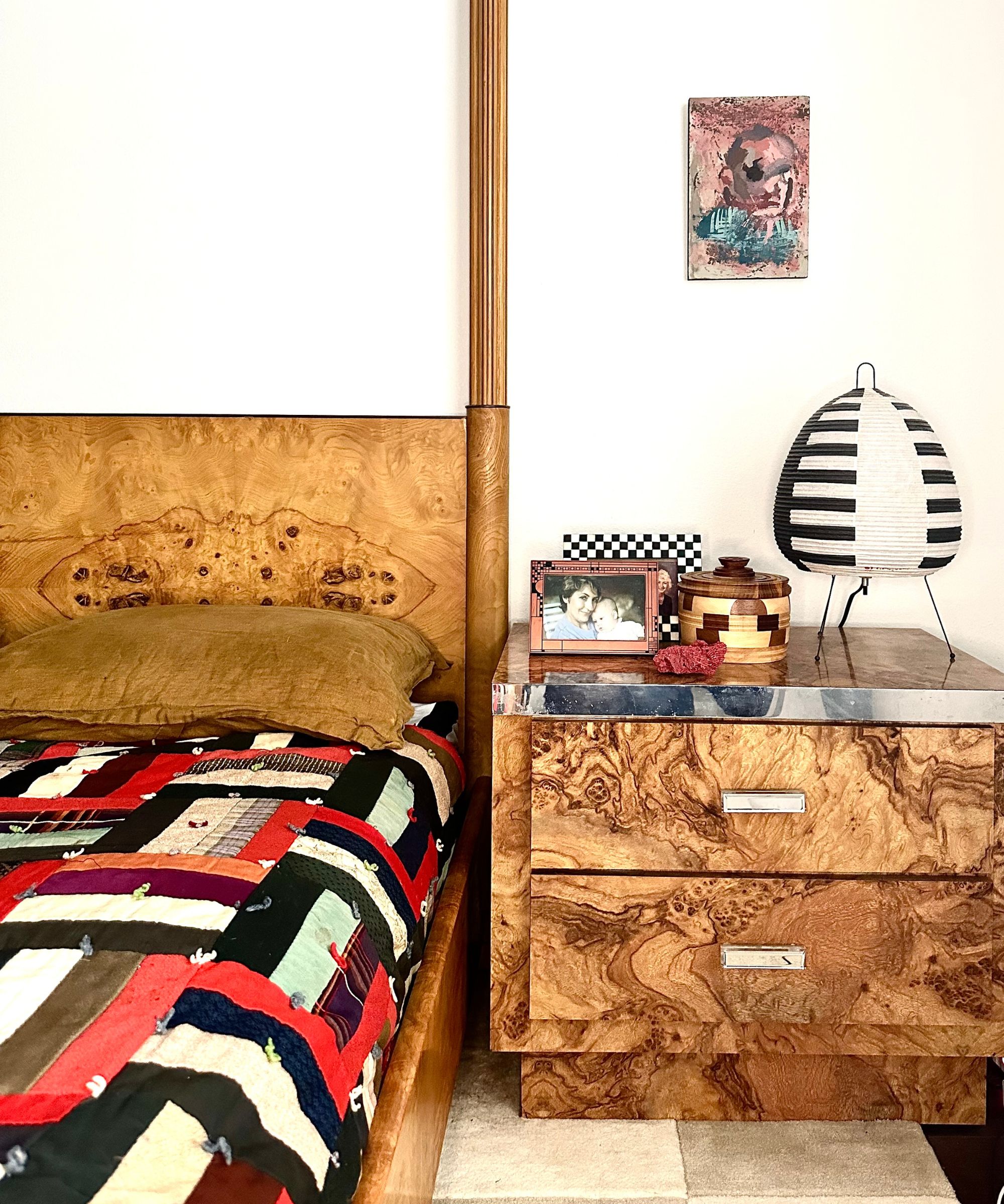 Vintage patchwork quilt on a burr wood bed