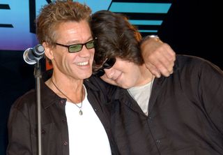 Eddie Van Halen (left) with his arm around his son, Wolfgang, at a press conference at the Four Seasons Hotel in Los Angeles, California on August 13, 2007