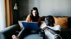 Chinese birth chart illustrated by couple looking at laptop together