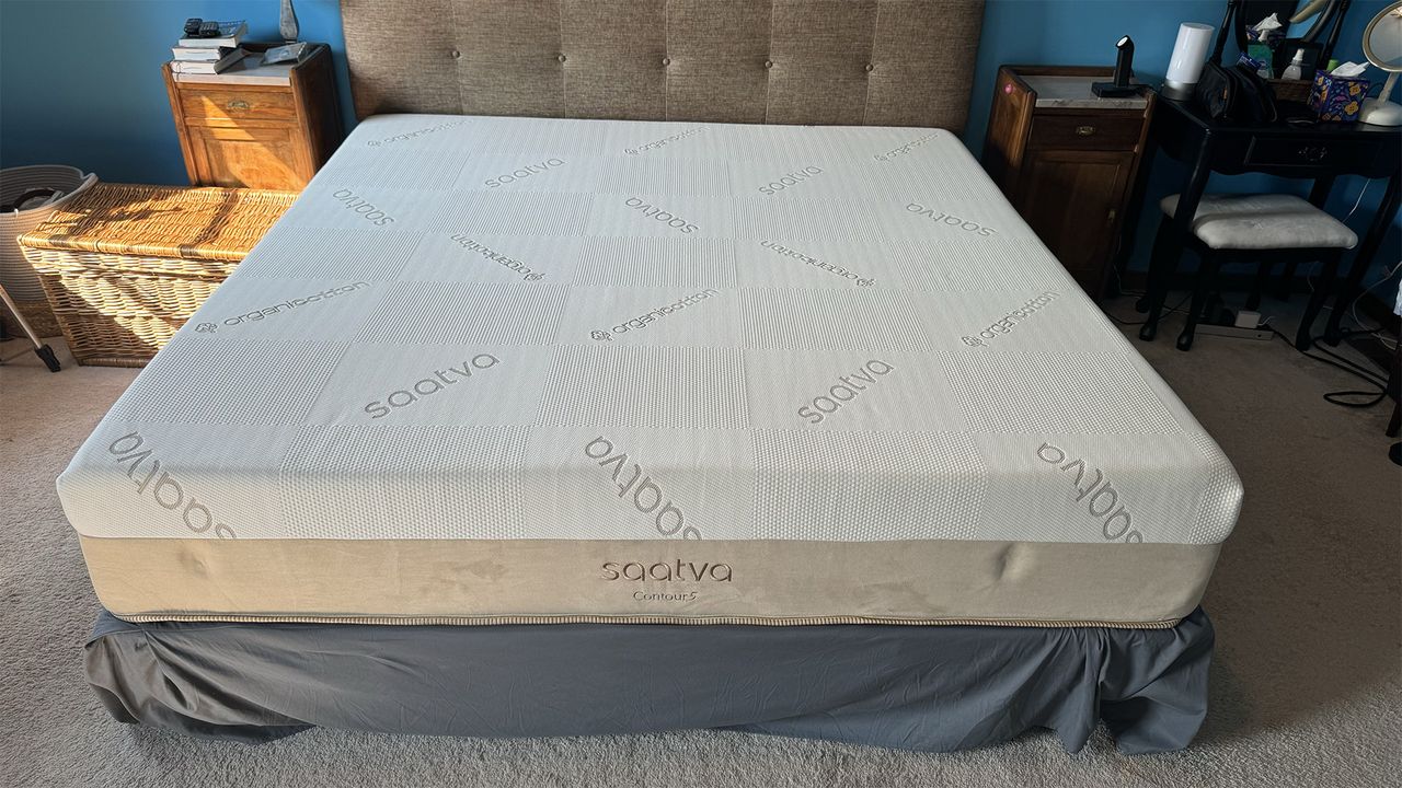 The Saatva Contour5 Mattress on a bed frame in a bedroom