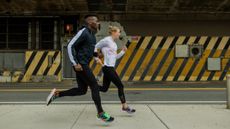 Saucony Kinvara 12 review: Pictured here, two runners jogging in an urban environement