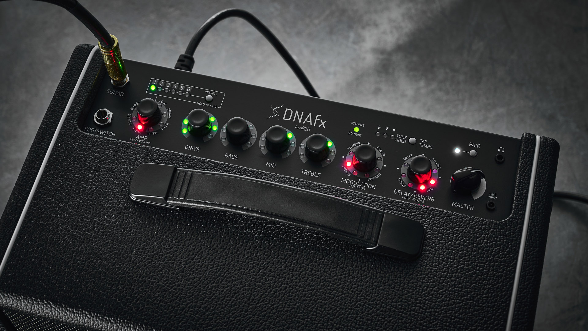Harley Benton DNAFX AmP20: the compact 1/8&quot; modelling combo is finished in black and photographed in close-up and against a slate floor