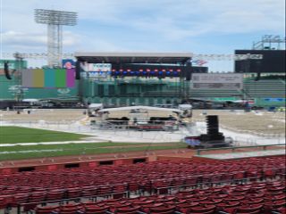 Bill Burr takes the stage a a green-lit Fenway Park back by d&b audiotechnik sound systems.