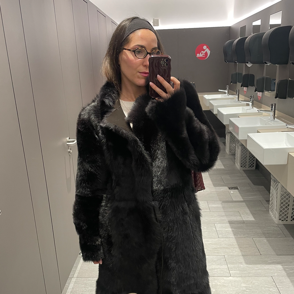 senior fashion editor Anna LaPlaca wearing a faux fur coat at the airport