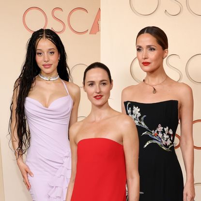 three women in gowns at the 2026 oscars