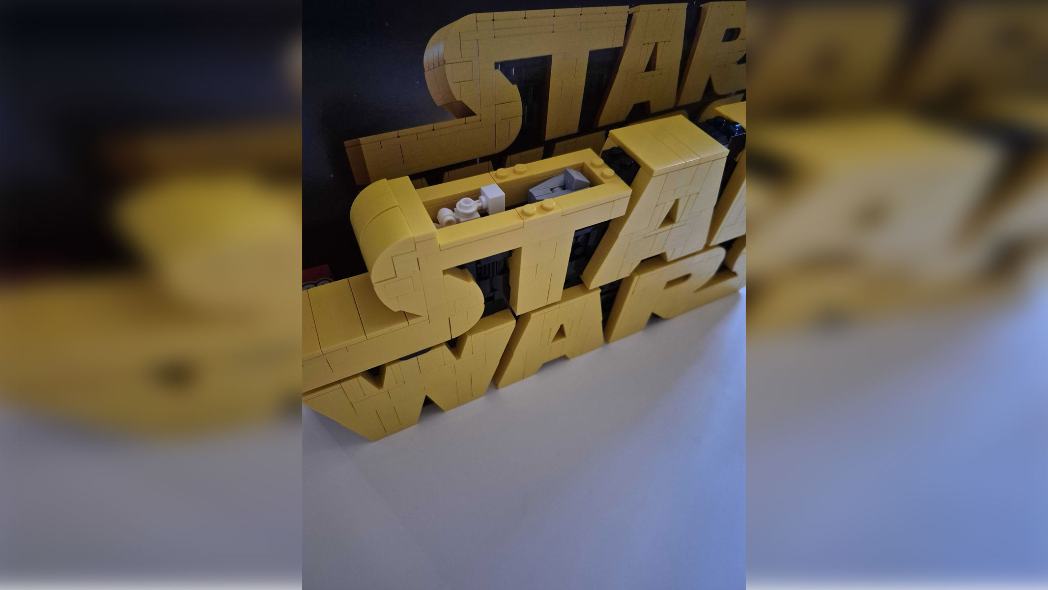 A hidden compartment within the Star Wars Logo built in Lego form.