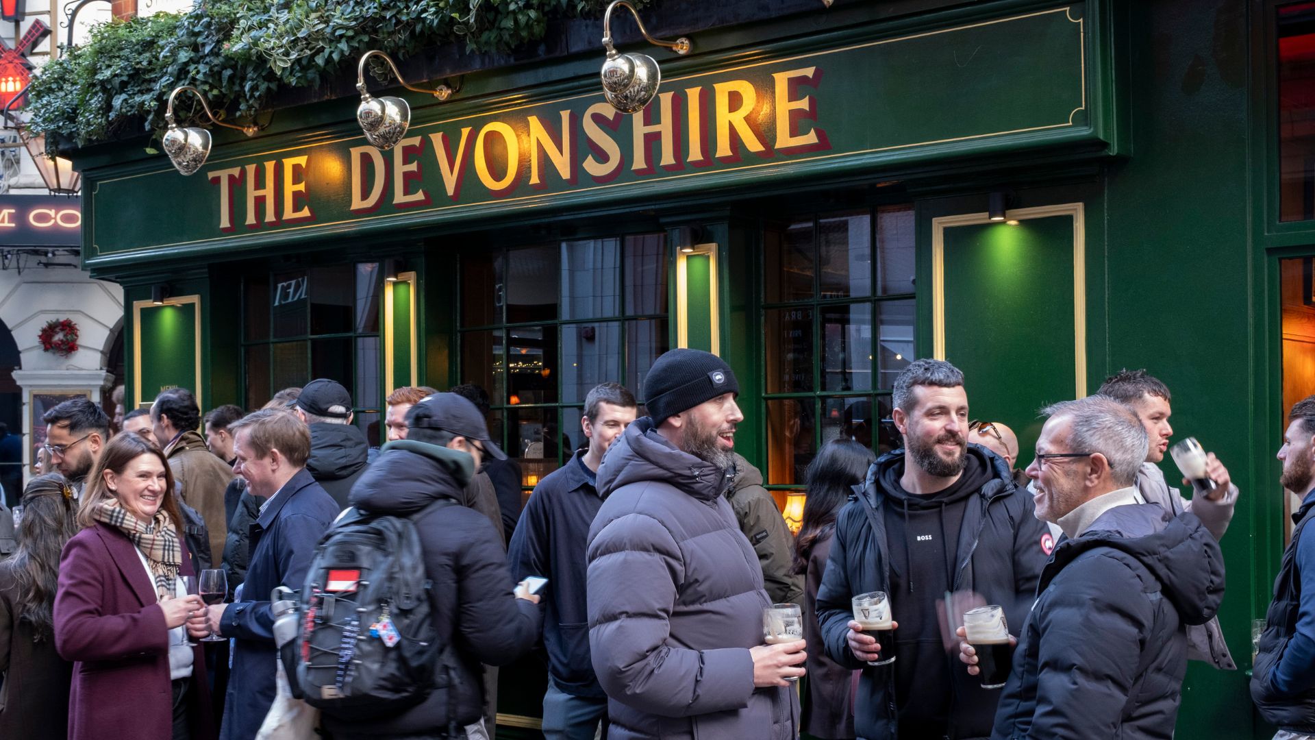 People enjoying a drink outside The Devonshire pub and restaurant in the West End on 30th November 2025 in London, United Kingdom. 
