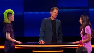 Rob Lowe talks to two contestants before a battle on The Floor.