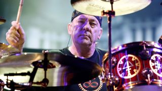 Neil Peart performing with Rush in 2012