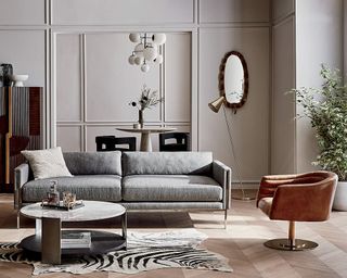 A contemporary gray sofa in a classic living room