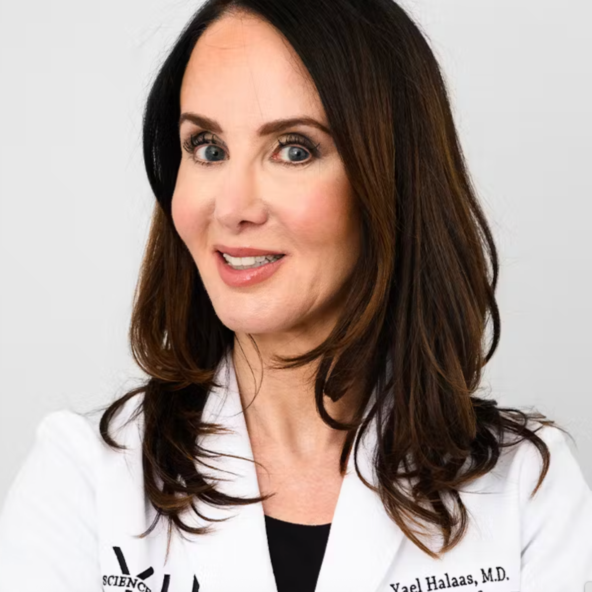 Dr. Yael Halaas in a white lab coat