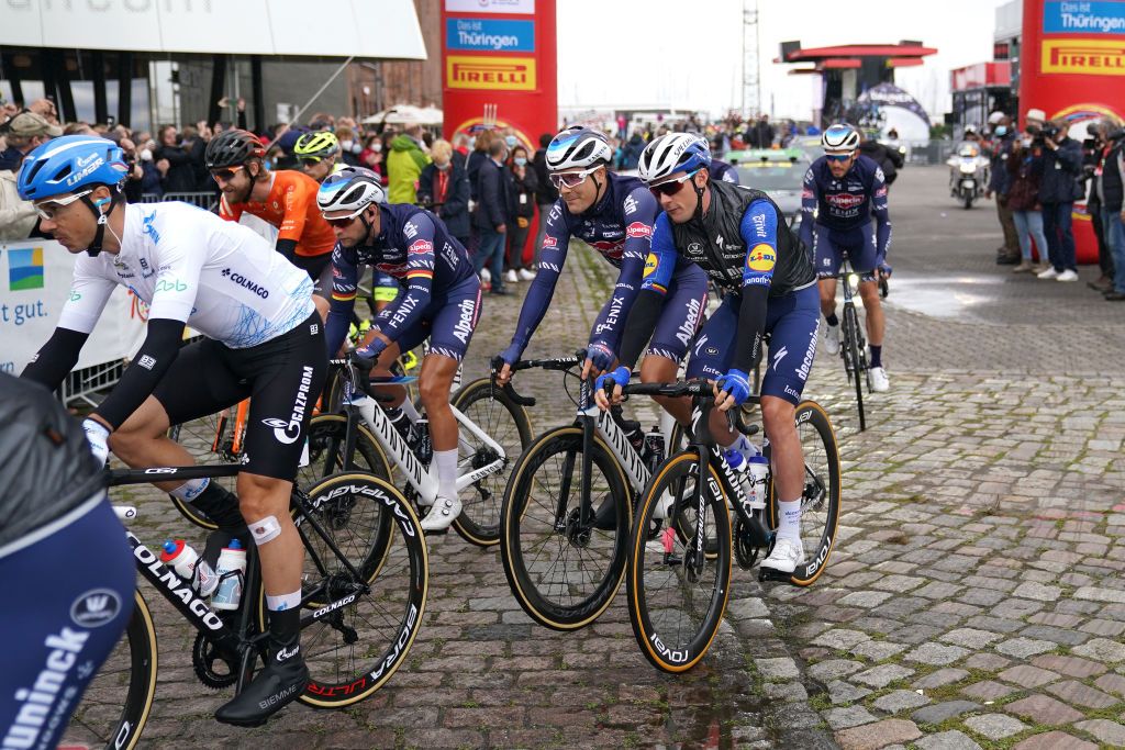 SCHWERIN GERMANY AUGUST 26 LR Marcel Meisen of Germany Louis Vervaeke of Belgium and Team AlpecinFenix Yves Lampaert of Belgium and Team Deceuninck QuickStep and The Peloton prior to the 35th Deutschland Tour 2021 Stage 1 a 191km stage from Stralsund to Schwerin DeineTour on August 26 2021 in Schwerin Germany Photo by Christian KasparBartkeGetty Images