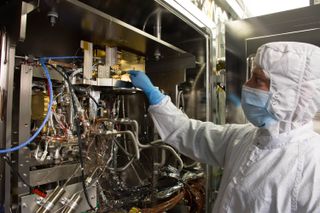 At Goddard Space Flight Center in Maryland, precision assembly and mechanical technician Ryan Wilkinson inspected the Mars Organic Molecule Analyzer, which will ride on the ExoMars Rover.