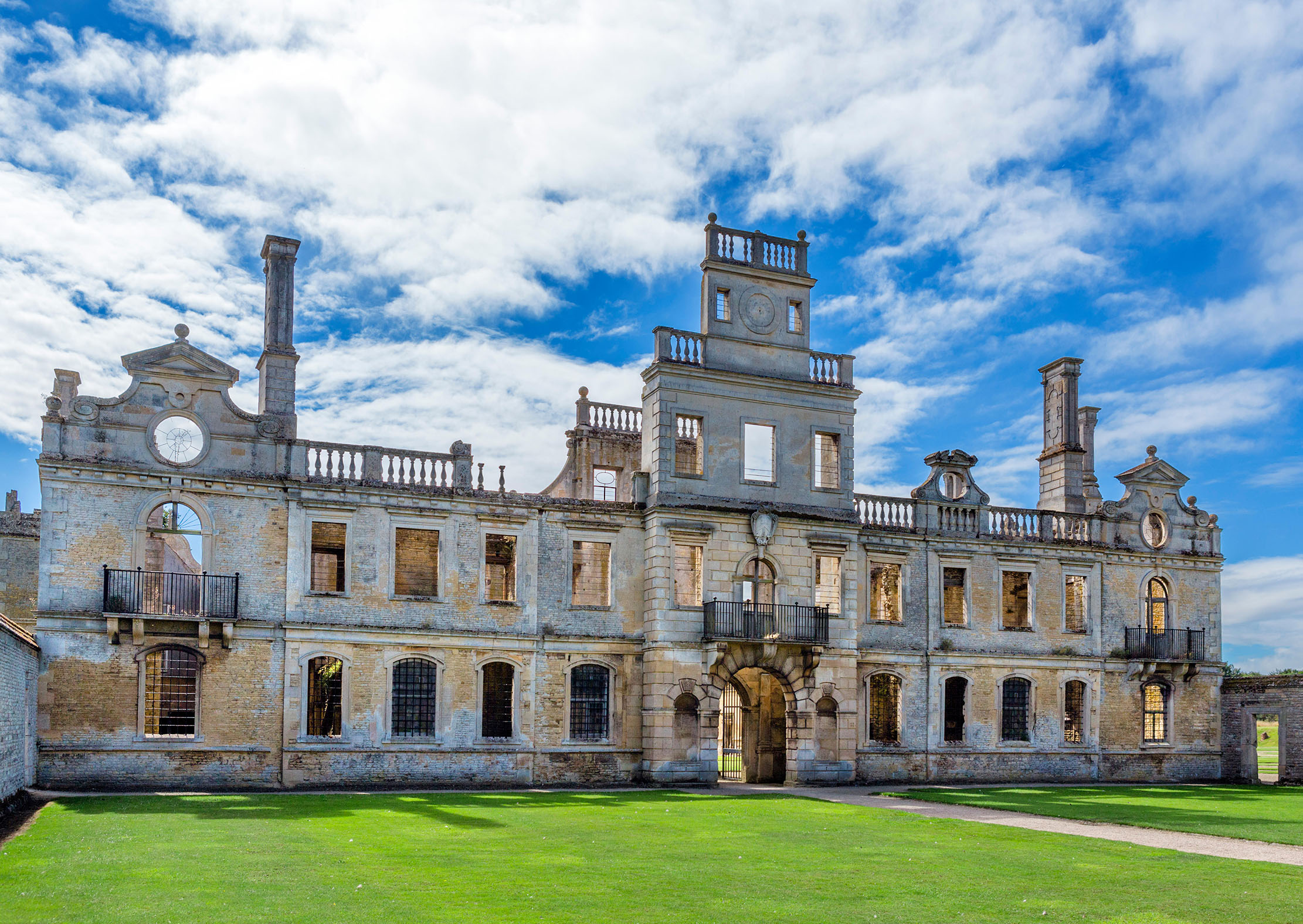 Entrance and north front from the forecourt in Kirby Hall, a ruined Elizabethan country house near Gretton, Northants.