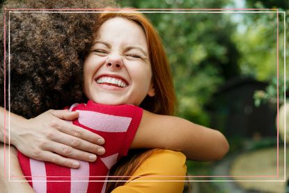 Woman smiling when she realises how to boost serotonin levels through hugging