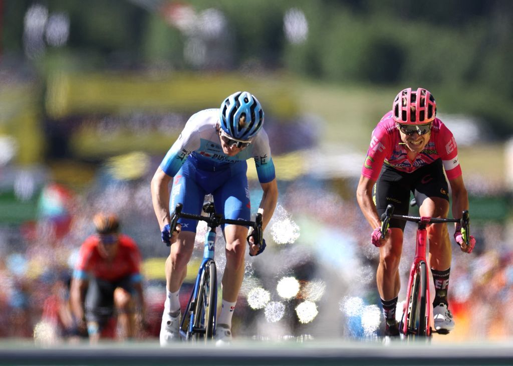 EF EducationEasypost teams Danish rider Magnus Cort Nielsen R cycles past Team BikeexchangeJayco teams Australian rider Nicholas Schultz to the finish line to win the 10th stage of the 109th edition of the Tour de France cycling race 1481 km between Morzine and Megeve in the French Alps on July 12 2022 Photo by Thomas SAMSON AFP Photo by THOMAS SAMSONAFP via Getty Images