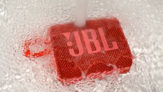The JBL Go 3 being doused in water