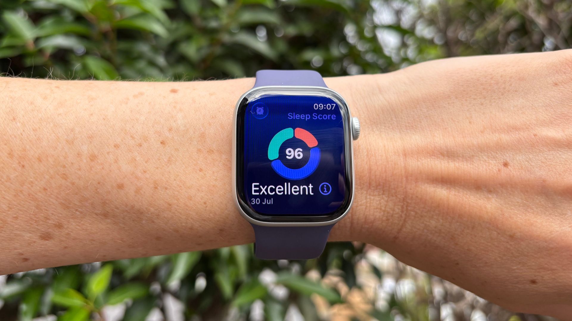 A hand wearing an Apple Watch series 11 displays a sleep score of 96 (excellent)