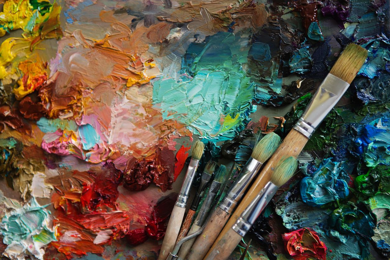 Paint brushes on a palette.