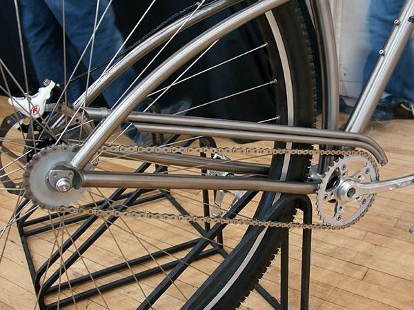 A twin-tubed titanium chain guard is cleanly fitted.