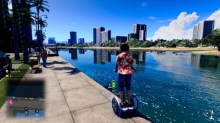 Like A Dragon Infinite Wealth - Ichiban rides a Segway-like electric scooter on a sidewalk near a river outside Honolulu City