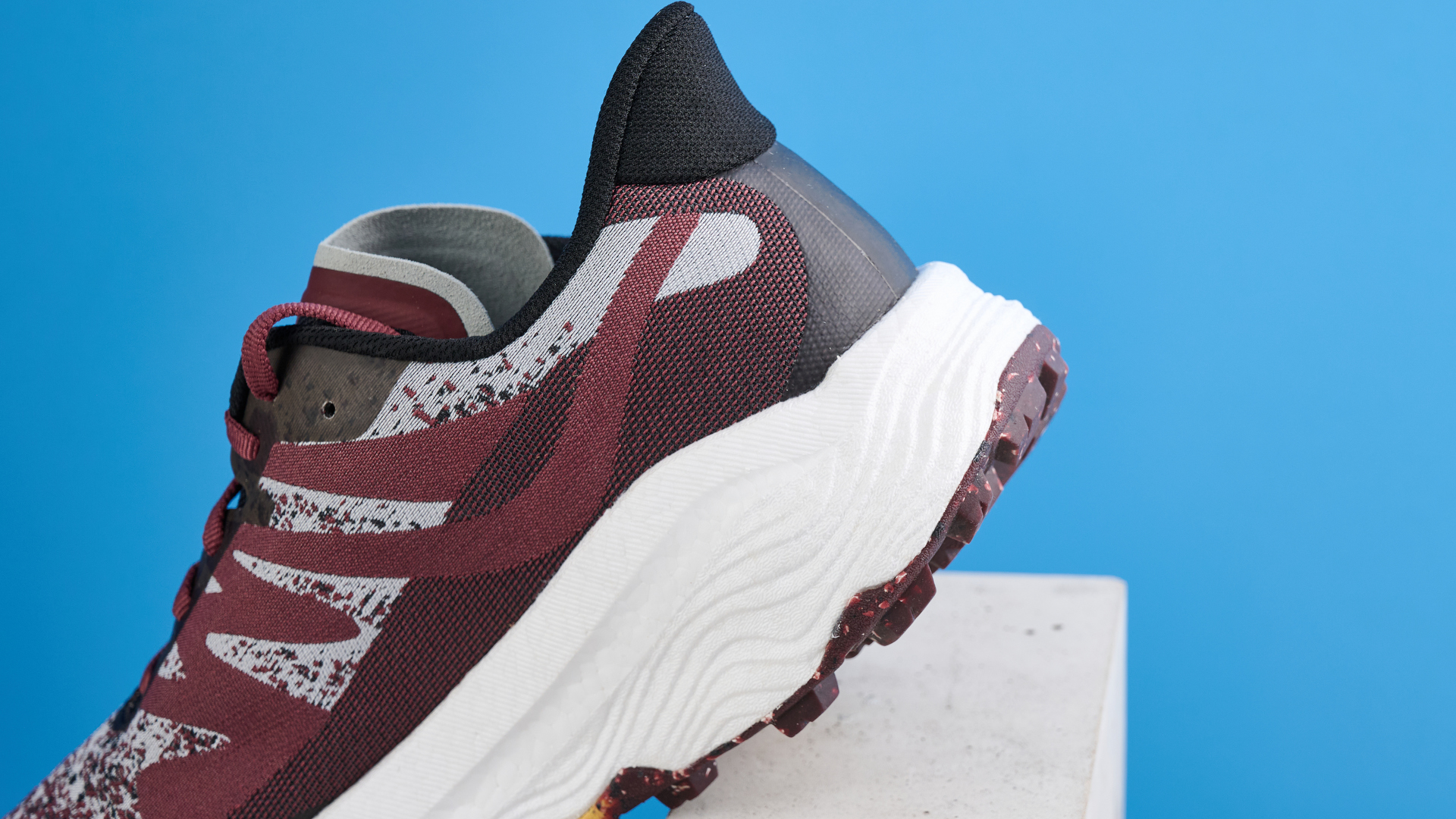 the icebug j&amp;auml;rv rb9x trail running shoes in cherry and banana photographed against the tom's guide blue background