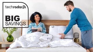 A woman sits on a Panda mattress while a man arranges a Panda pillow