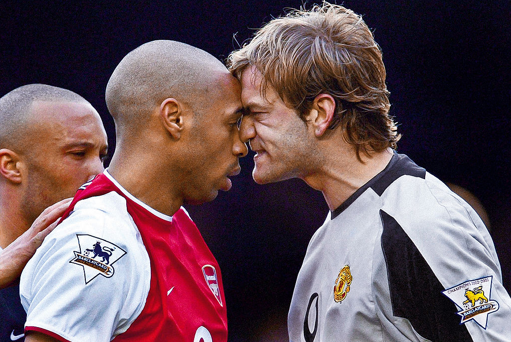 Thierry Henry of Arsenal (left) is angrily confronted by Roy Carroll, the Manchester United goalkeeper during the Arsenal versus Manchester United Premier League match at Highbury stadium on March 28th 2004 in London.