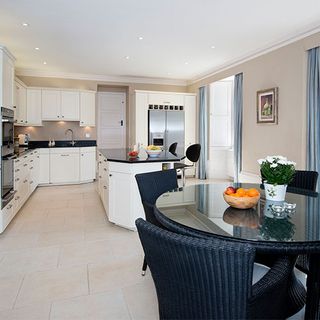 dining area with glass dining table and chairs