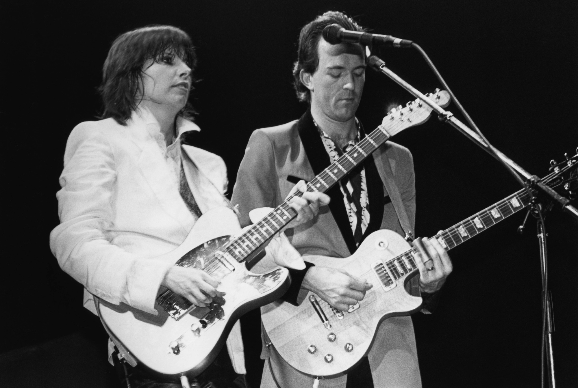 Chrissie Hynde (left) and Robbie McIntosh of the Pretenders perform onstage in 1984
