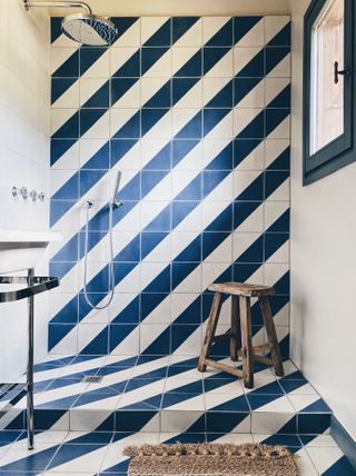 blue & white shower tiles in walk in shower