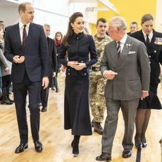 Prince William, Kate Middleton and then-Prince Charles during a joint visit to the defence medical rehabilitation centre (DMRC) Stanford Hall on February 11, 2020 in Loughborough, United Kingdom