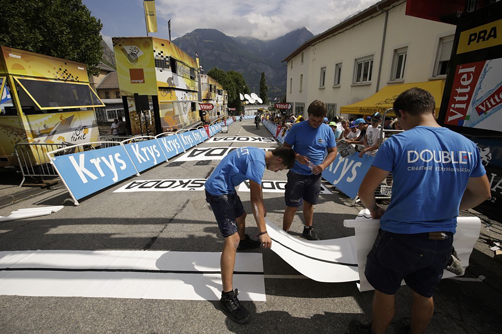 Race organizers setting up the finish line in Saint-Jean-de-Maurienne