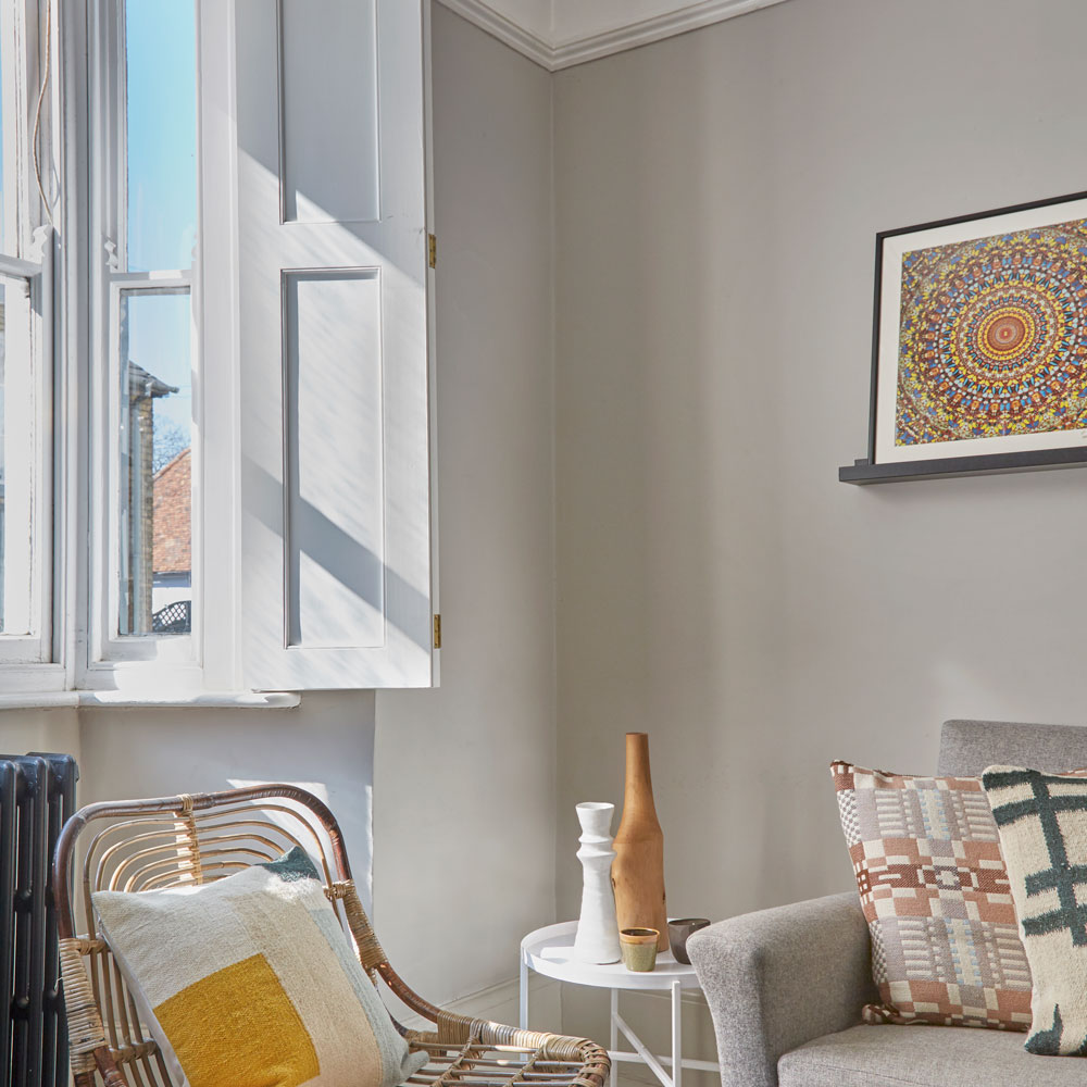 living room with grey wall and chair