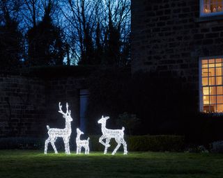 Festive pre-lit reindeer in a front garden