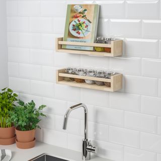 kitchen with wall mounted wooden spice racks, white metro tiles, white countertop