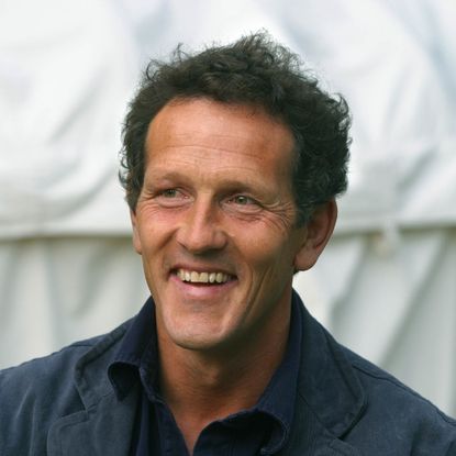 Monty Don wearing navy jacket and smiling