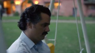 Wagner Moura with a mustache looking sad