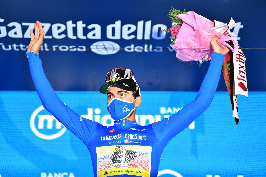MADONNA DI CAMPIGLIO ITALY OCTOBER 21 Podium Ruben Guerreiro of Portugal and Team EF Pro Blue Mountain Jersey Celebration Flowers during the 103rd Giro dItalia 2020 Stage 17 a 203km stage from Bassano del Grappa to Madonna di Campiglio 1514m girodiitalia Giro on October 21 2020 in Madonna di Campiglio Italy Photo by Stuart FranklinGetty Images