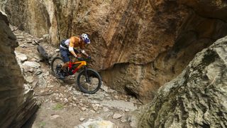 Payson McElveen rides the new Trek Top Fuel downcountry bike down a rocky chute