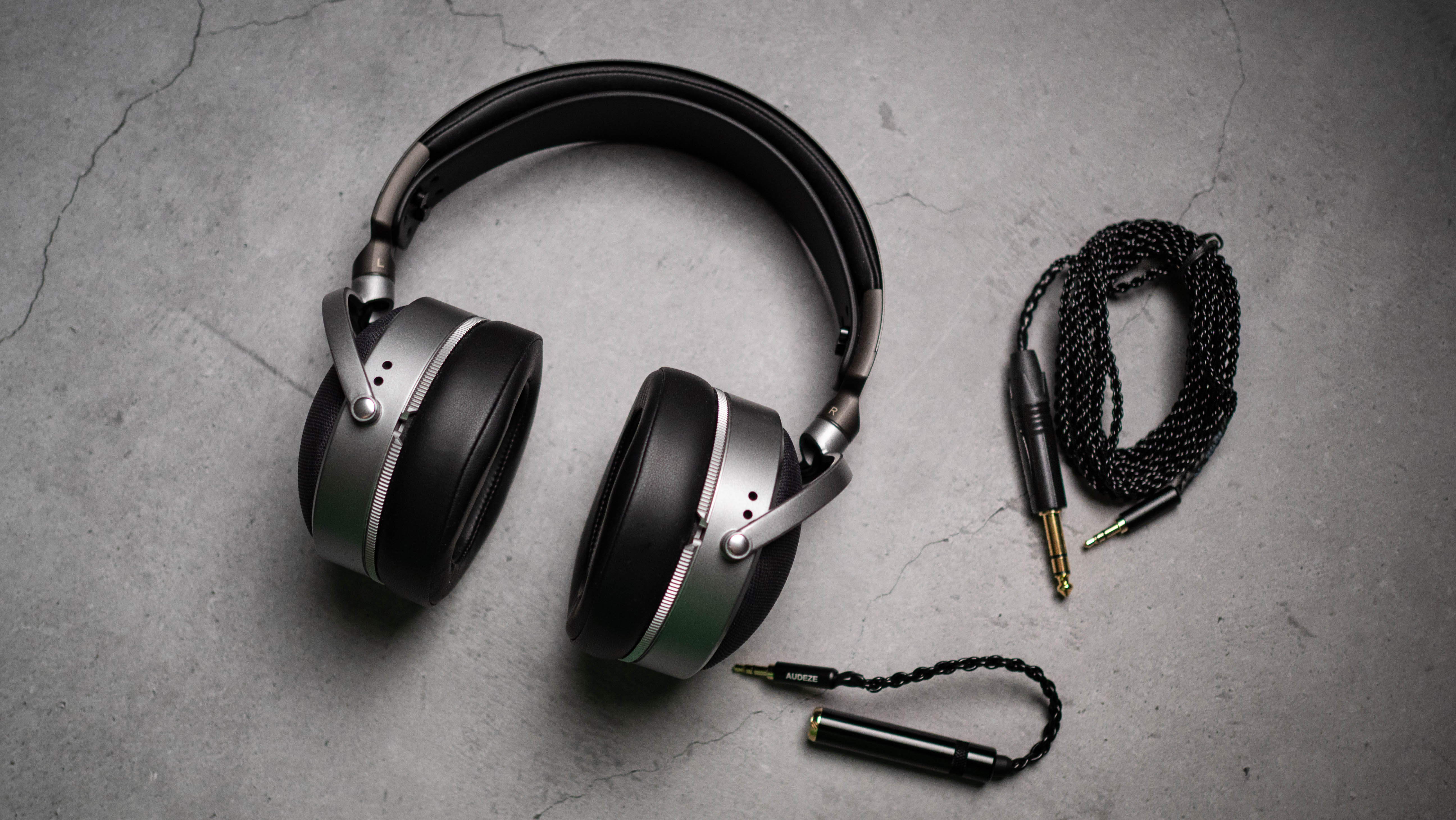Audeze LCD-S20 planar headset against a grey craft sheet highlighting the product design