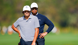 Tiger and Charlie Woods line-up a birdie putt