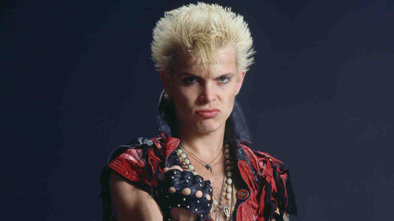 Billy Idol posing for a photograph in the 1980s