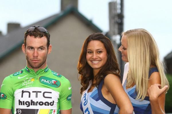 Cavendish puts on a straight face in the company of the podium girls.