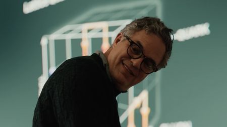 Bruce Banner smiling in his classroom in the Spider-Man: Brand New Day trailer.