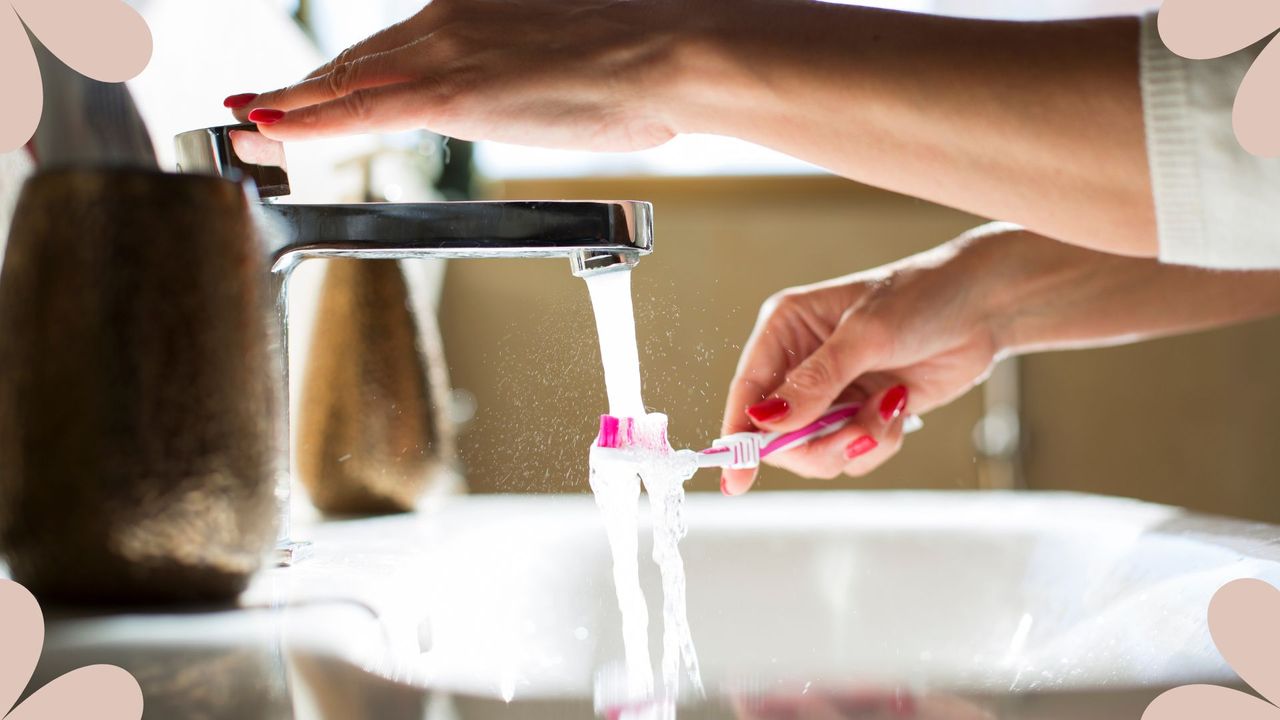 How long should you be brushing your teeth - woman cleaning her brush off 