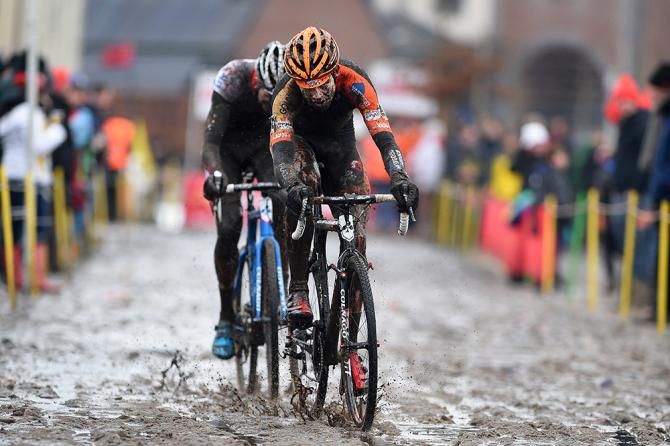 Wout Van Aert leads through the mud at Bpost Bank Trofee Azencross.