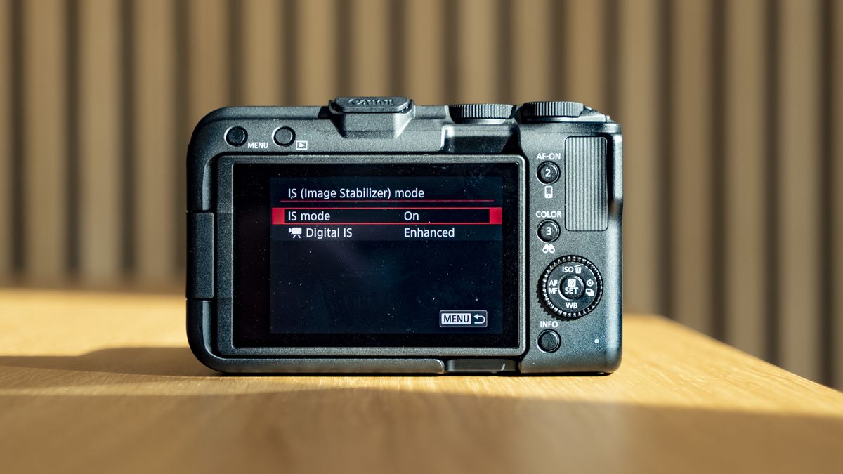 Rear of the Canon EOS R50 V, on a wooden table, screen on