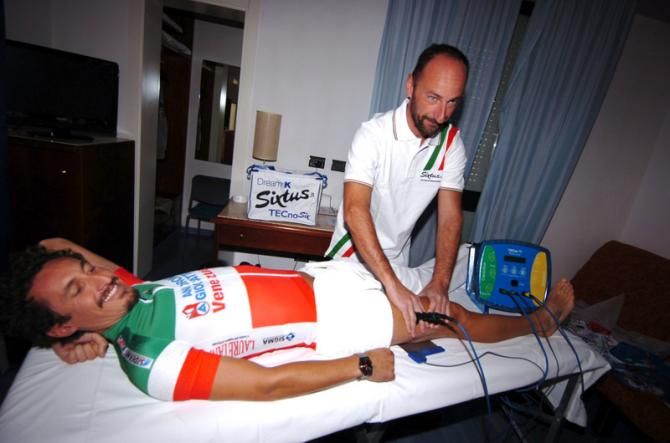 Team therapist gives Pellizotti some treatment with the Technosix