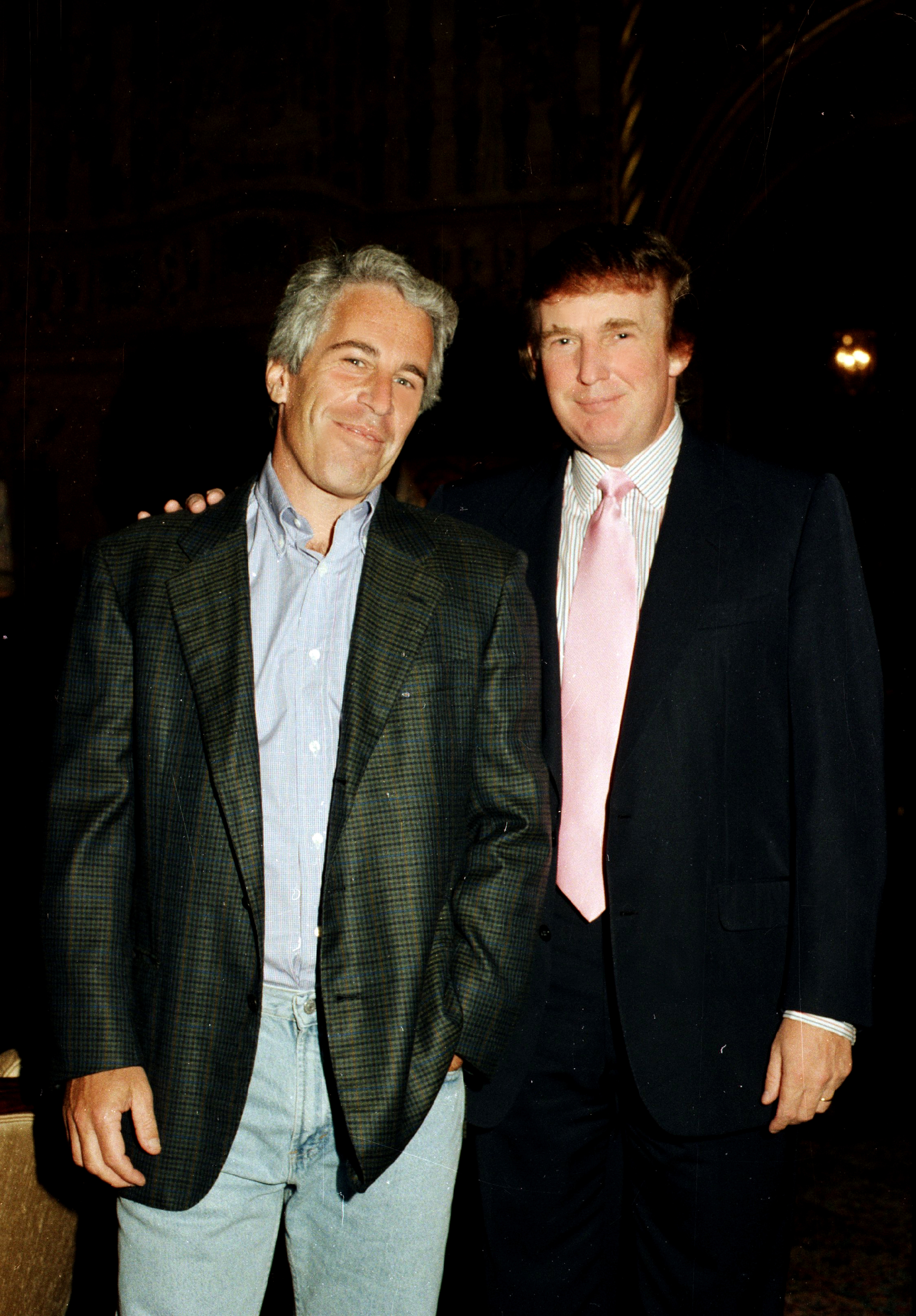 Portrait of American financier Jeffrey Epstein (left) and real estate developer Donald Trump as they pose together at the Mar-a-Lago estate, Palm Beach, Florida on February 22, 1997. (Photo by Davidoff Studios/Getty Images)